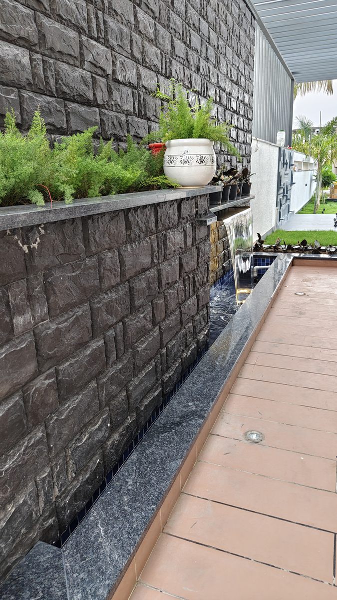 V Design custom black stone tiered waterfall